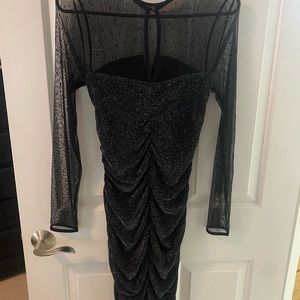 Black sparkly dress with sheer polka dot sleeves. Ruched dress.